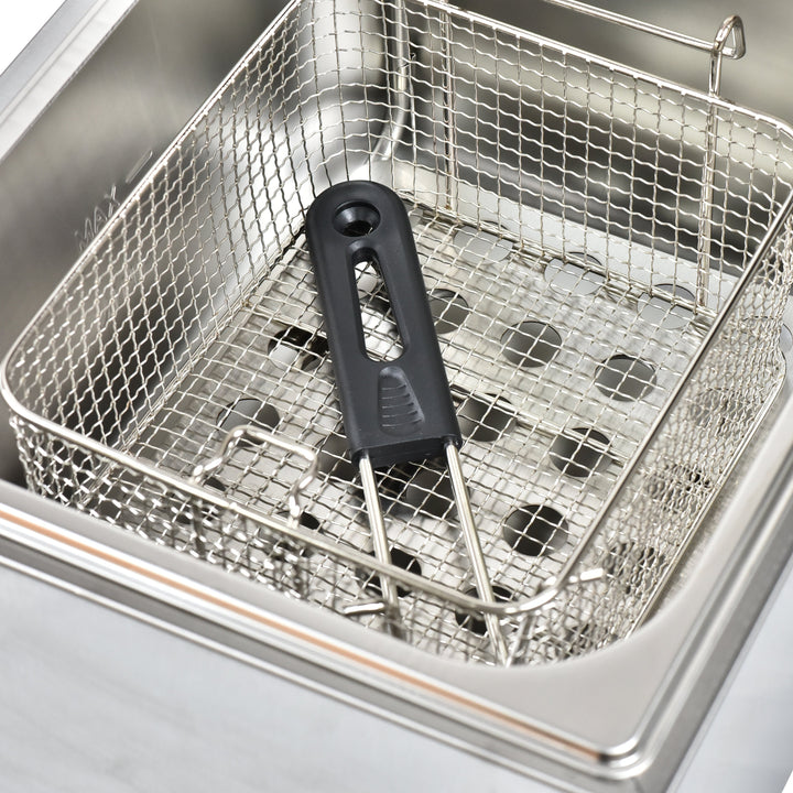 Inside view of a commercial fryer showcasing a stainless steel basket with a black handle, designed for efficient cooking.