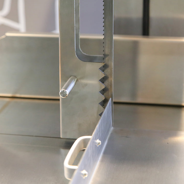Detail of stainless steel blade and frame of KRD Professional Bone Saw, designed for heavy-duty meat cutting.