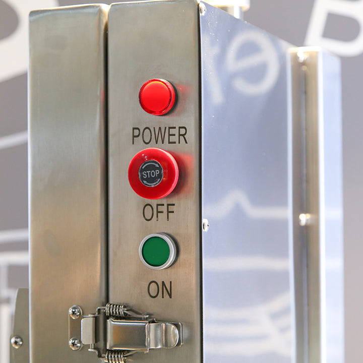 Close-up of KRD Professional Bone Saw power control panel with red, stop, and green buttons.