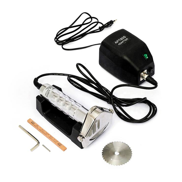 Metalworking tool kit with grinder, adapter, and accessories on a white background