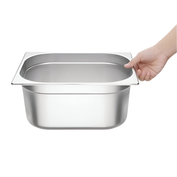Stainless steel GN 1/2 gastronorm pan, depth 150mm, being held by a hand, ideal for food storage in kitchens.