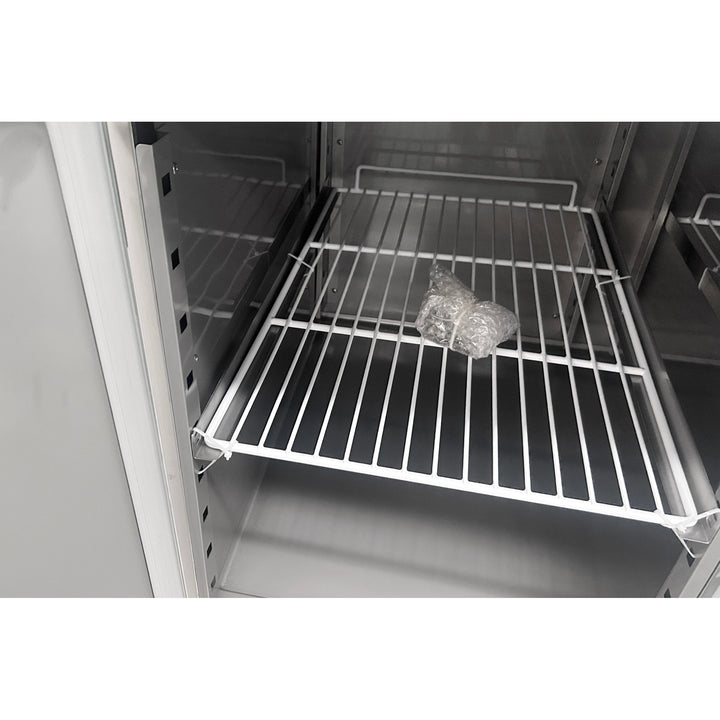 Interior view of KRD Refrigerated Pizza & Bakery Counter 2 doors Granite top Depth 800mm showing wire shelf and storage space.