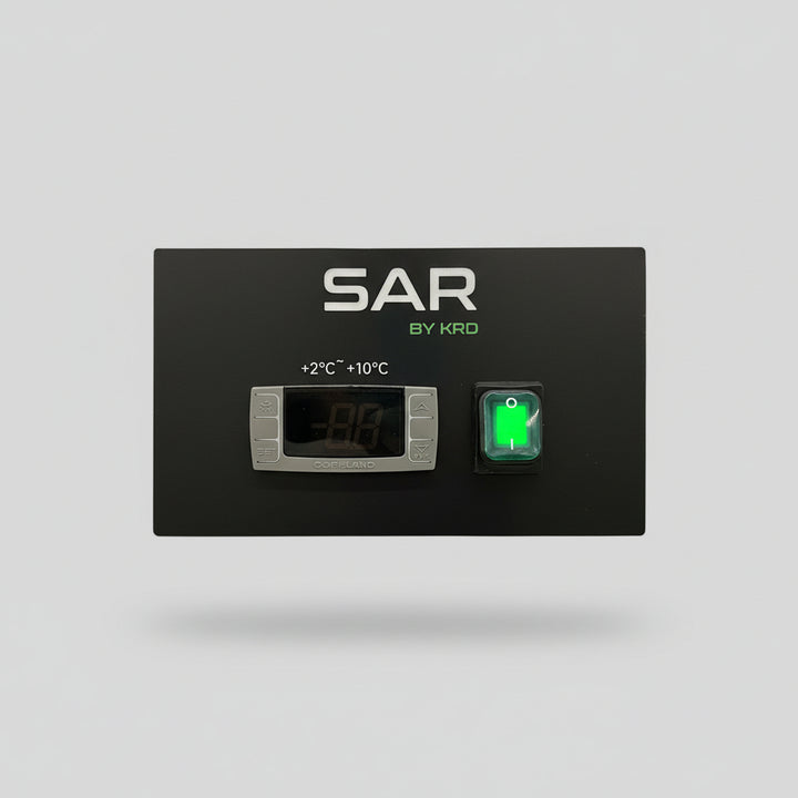 Temperature control panel for commercial kitchen equipment with display and indicator light.