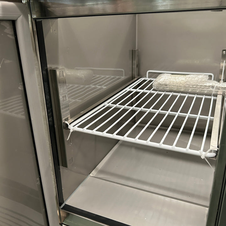 KRD Commercial Saladette Fridge Glass top 3 doors interior showing a stainless steel shelf for food storage in a commercial kitchen.