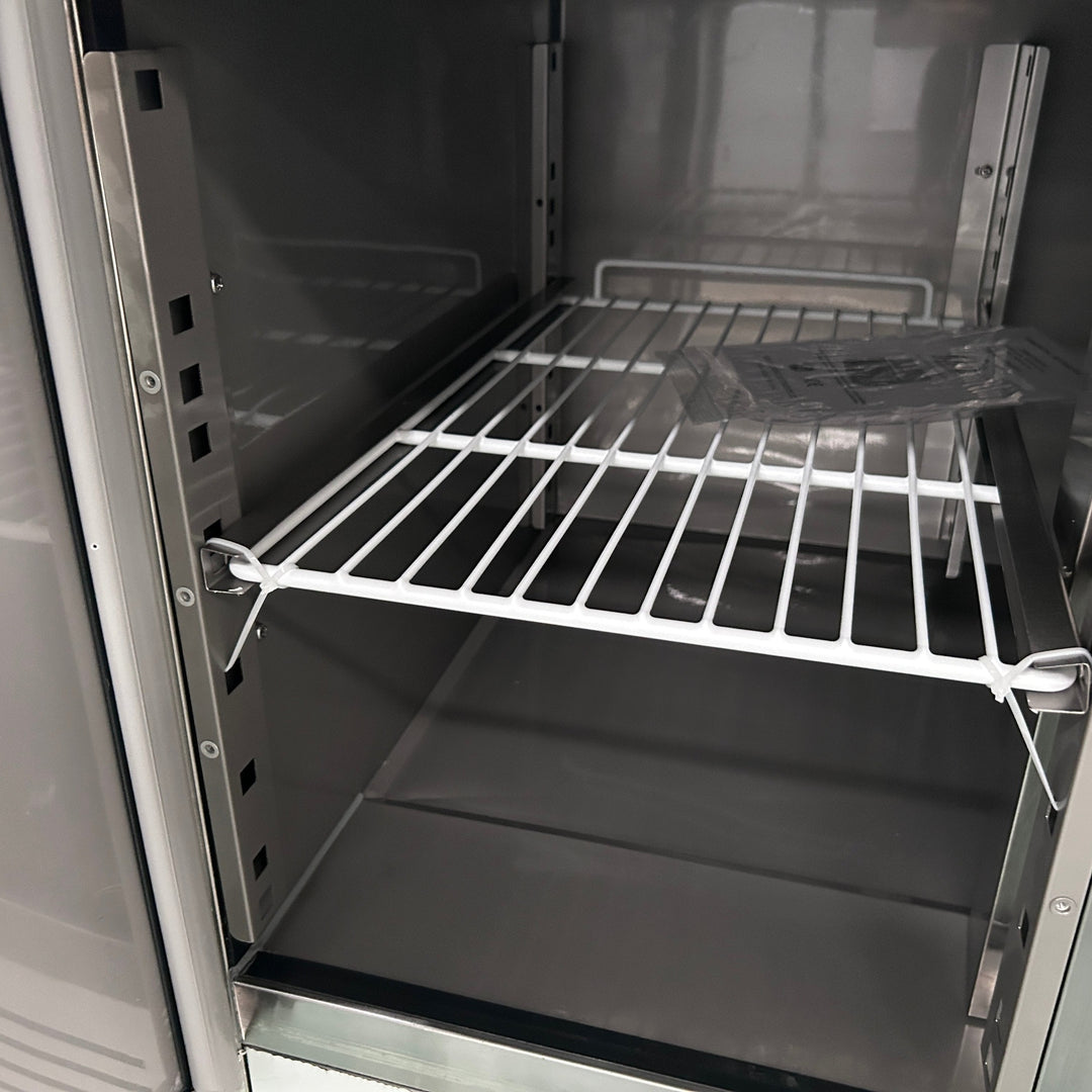 Interior of KRD Refrigerated Prep Table 3 doors Sandwich top 8xGN1/6 showing white wire shelving for efficient storage.