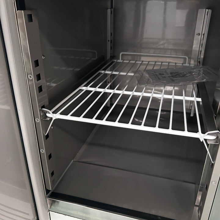 Interior of KRD Refrigerated Prep Table 3 doors Sandwich top 8xGN1/6 showing white wire shelving for efficient storage.