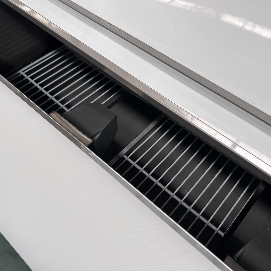 Commercial 3 Door Prep Counter Fridge Saladette Table 4xGN1/1 Pans showcasing its stainless steel interior with wire shelves.