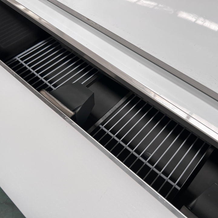 Commercial 3 Door Prep Counter Fridge Saladette Table 4xGN1/1 Pans showcasing its stainless steel interior with wire shelves.