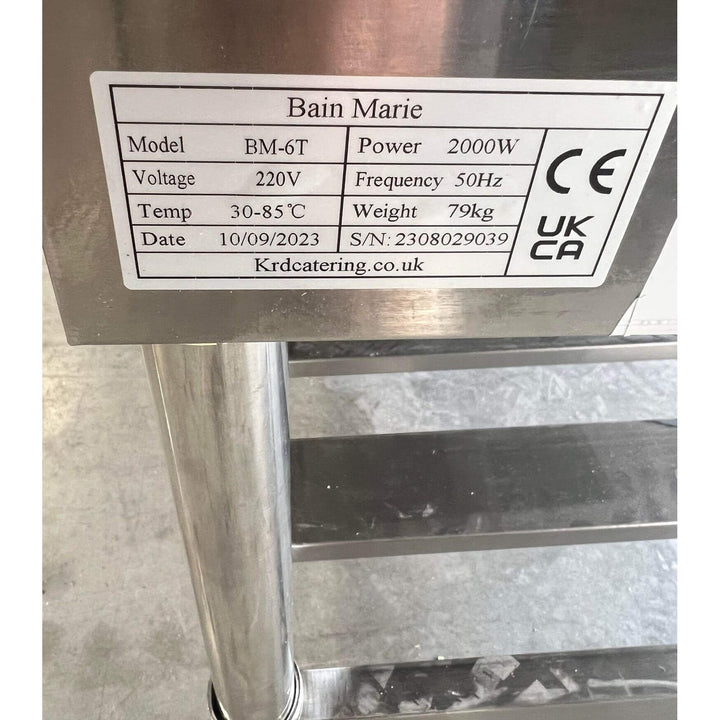 Label of KRD Electric 6 Open Well Steam Table Food Warmer With Under-Shelf detailing model, power, voltage, temperature range, weight.