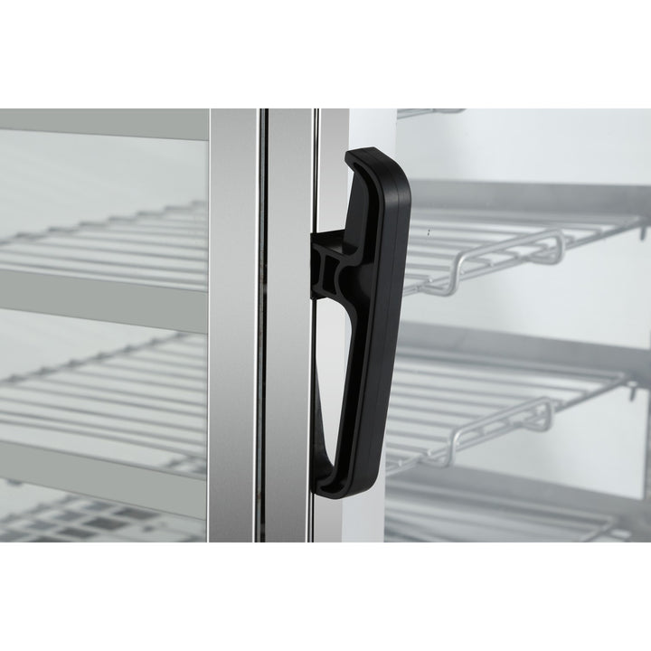 Close-up of the handle on a commercial fridge door, designed for easy access to stainless steel shelves.