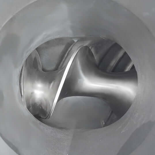 Close-up of stainless steel auger inside KRD TK52 meat mincer for efficient meat grinding.