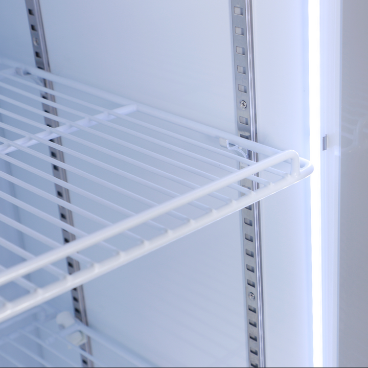 Interior view of a white wire shelf in a KRD Upright Single Door Glass Display Refrigerator White 68cm LGT460WL.