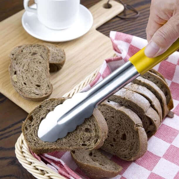KRD Colour Coded Yellow Utility Serving Tongs clip 300mm 12" holding slices of bread in a basket.