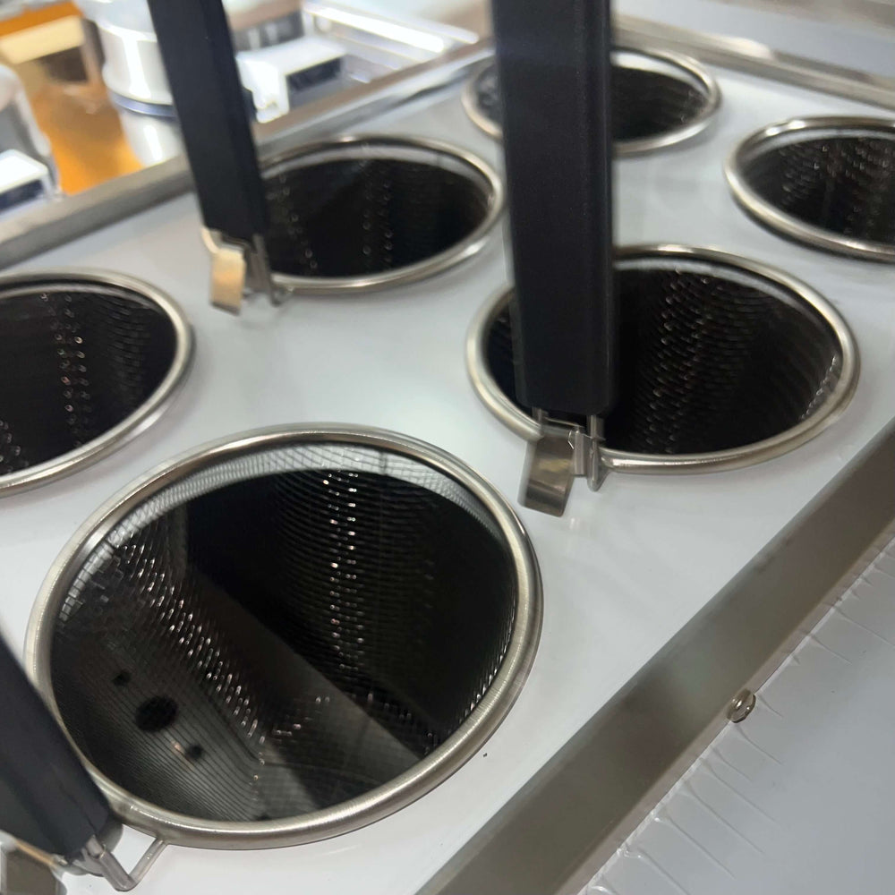 KRD Commercial Electric Pasta Cooker 6 stainless steel baskets with handles for boiling pasta.