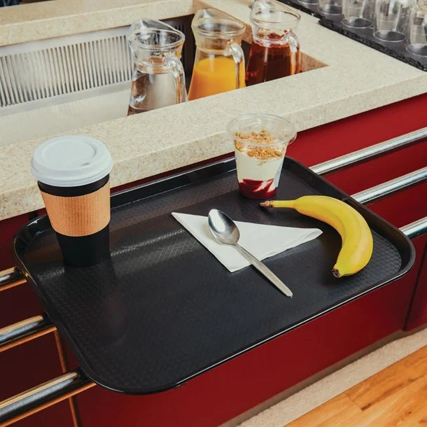 KRD Kristallon Polypropylene Fast Food Tray Small 345mm (coloured) with coffee, dessert, and fruit on commercial kitchen counter.