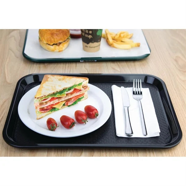 KRD Kristallon Polypropylene Fast Food Tray Small 345mm (coloured) with sandwich and cutlery on textured surface for stability.