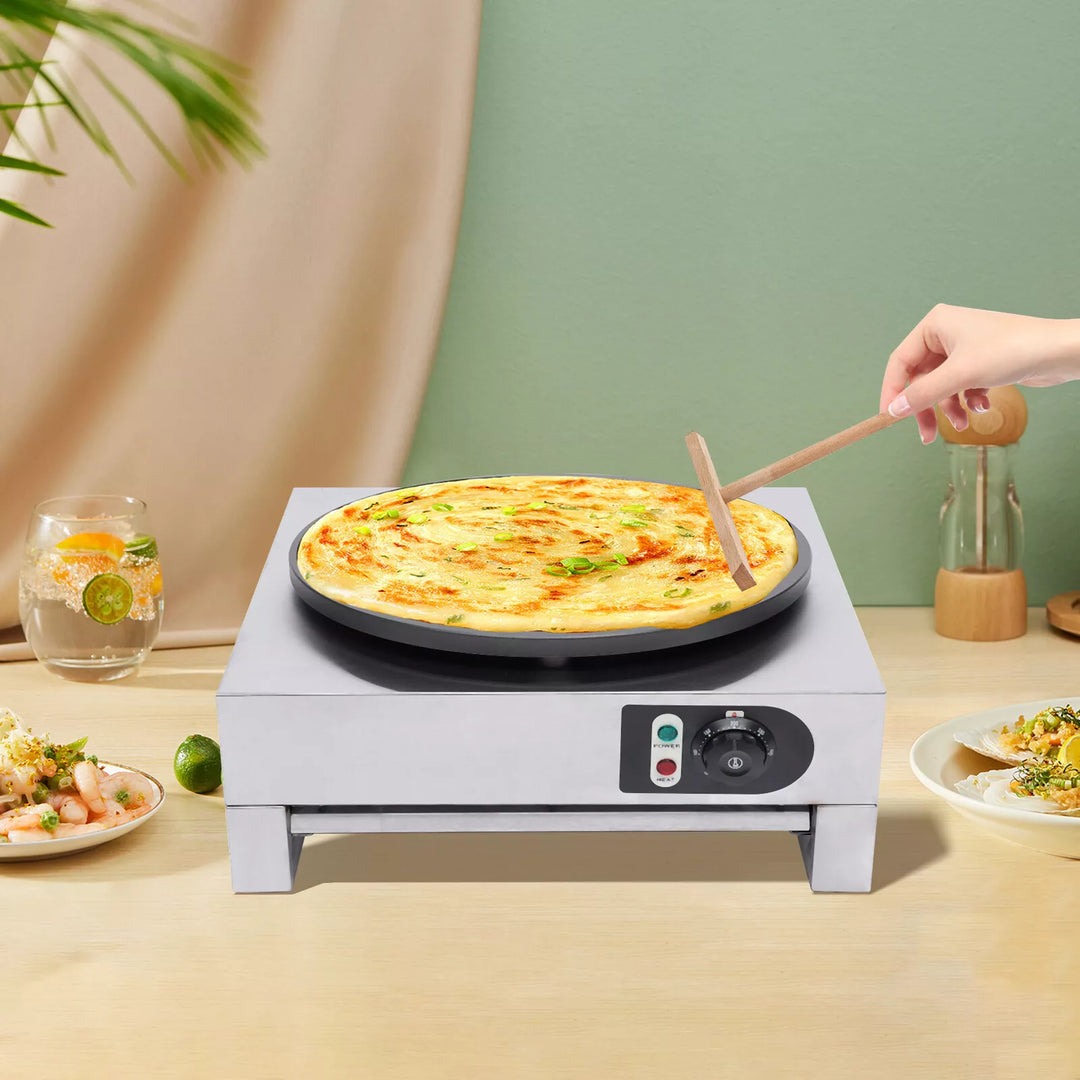 KRD Commercial Electric Crepe maker with pizza on plate, showcasing its smooth enamel surface and easy operation.